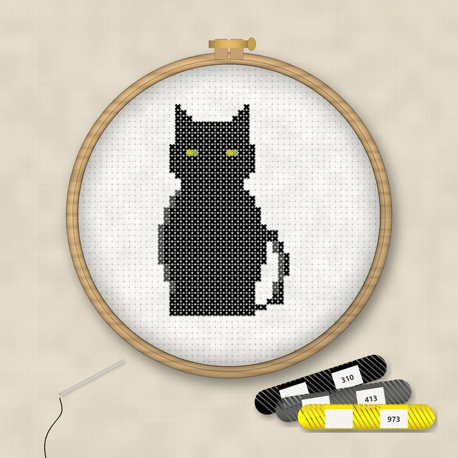 Black Cat cross stitch finished in a wooden embroidery hoop with DMC thread skeins