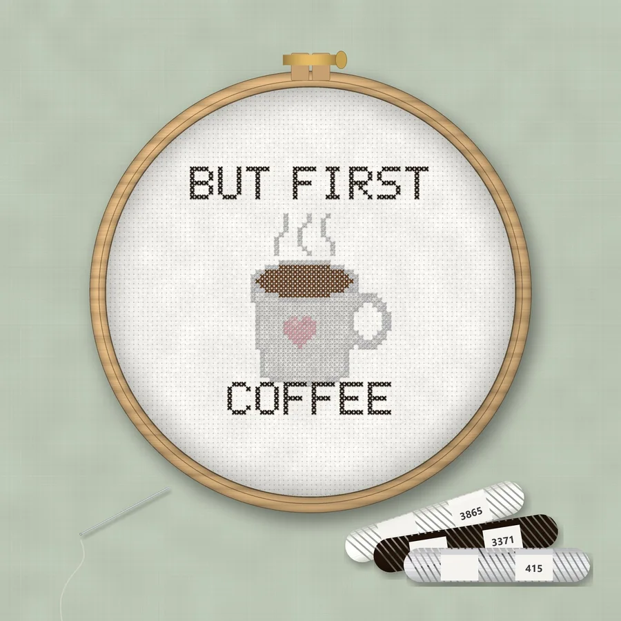 But First Coffee cross stitch finished in a wooden embroidery hoop with DMC thread skeins