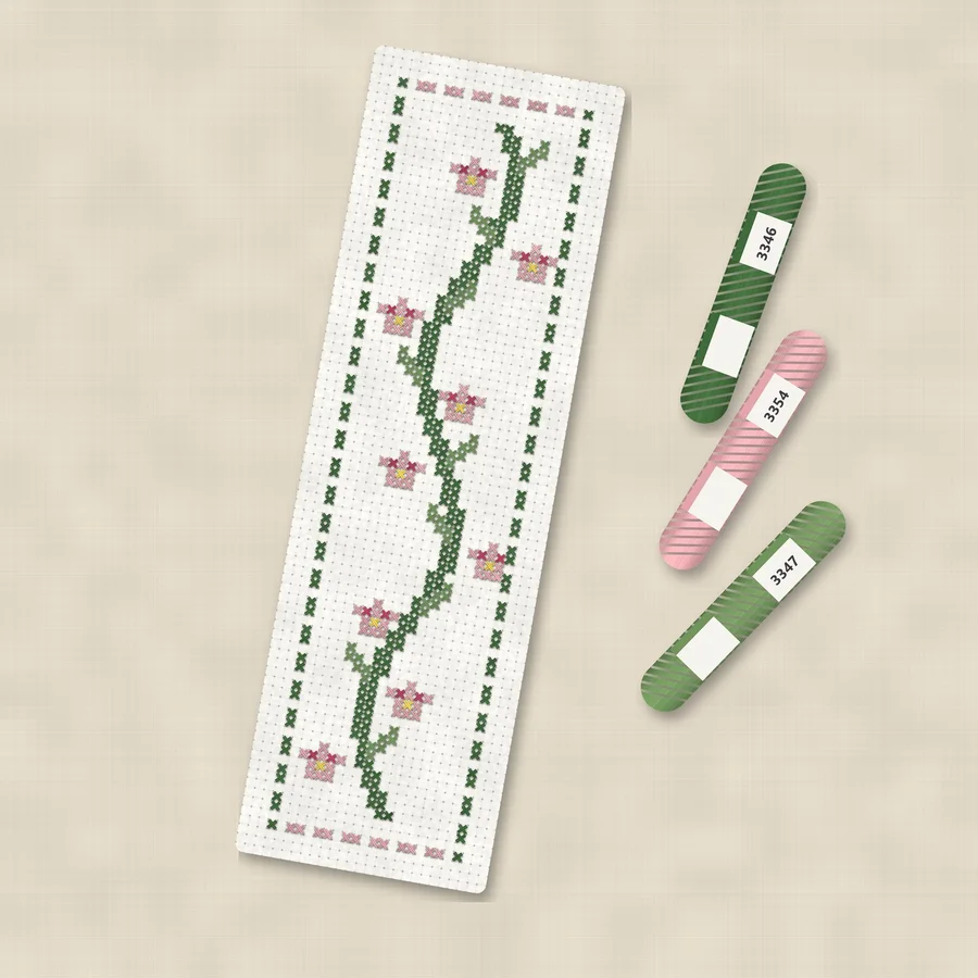 Floral Bookmark cross stitch finished in a wooden embroidery hoop with DMC thread skeins