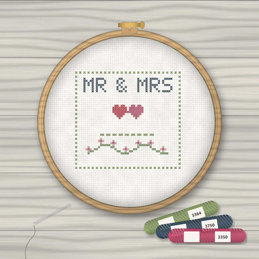 Mr and Mrs Wedding cross stitch finished in a wooden embroidery hoop with DMC thread skeins
